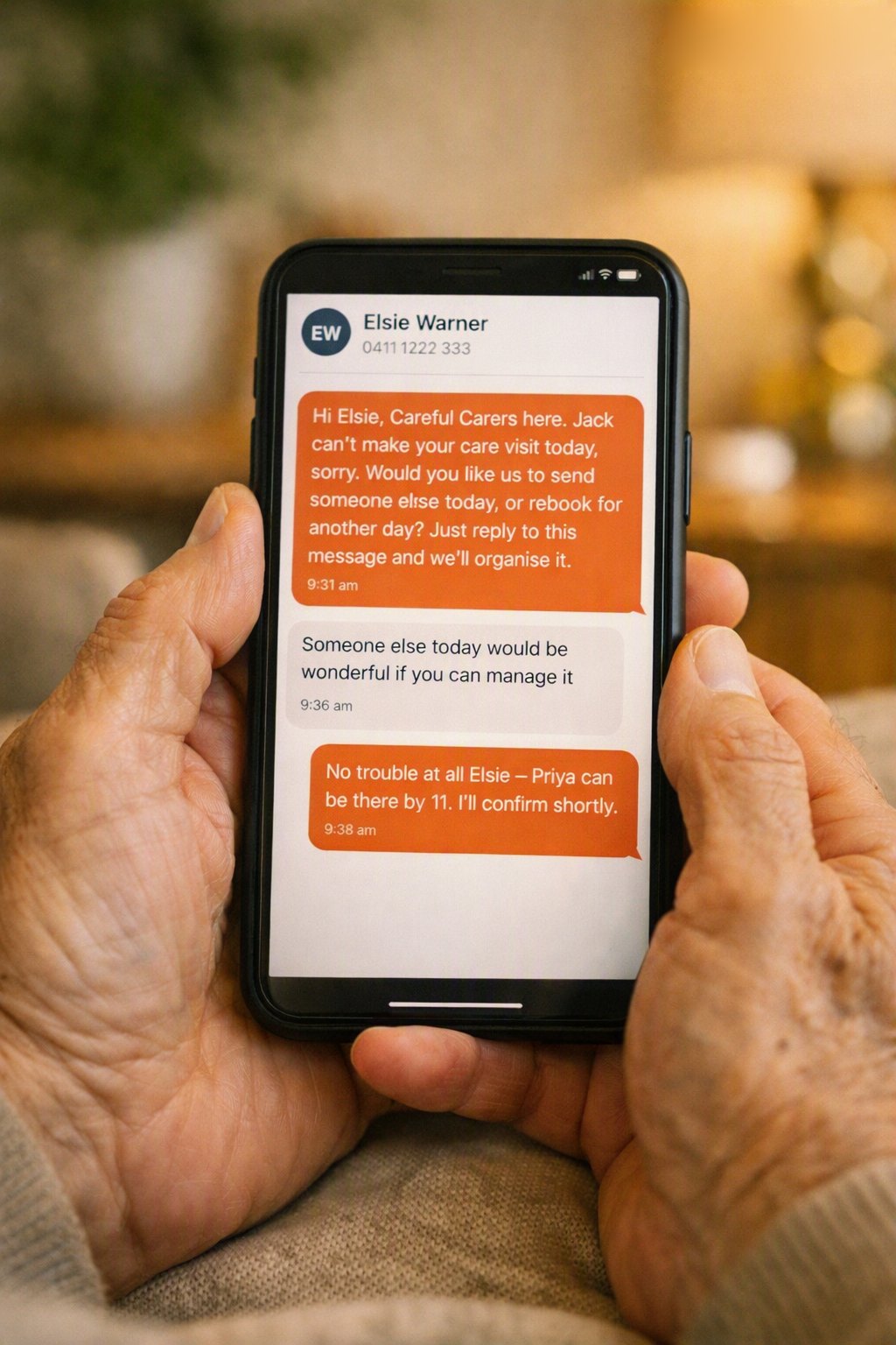A client reading a NAS text message on their phone and replying